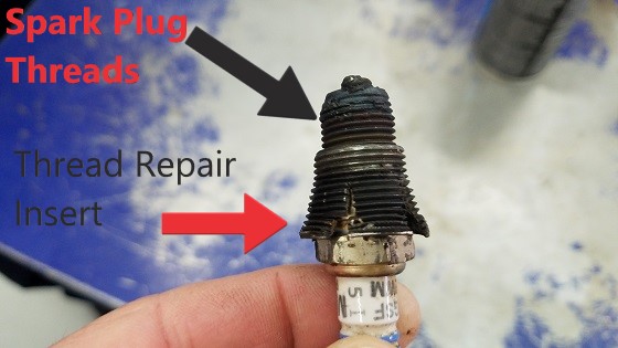 Spark plug thread repair, Example of a poor job. The insert has been forced and is split.