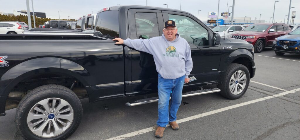 Used Car shopping, Man with his used car purchase